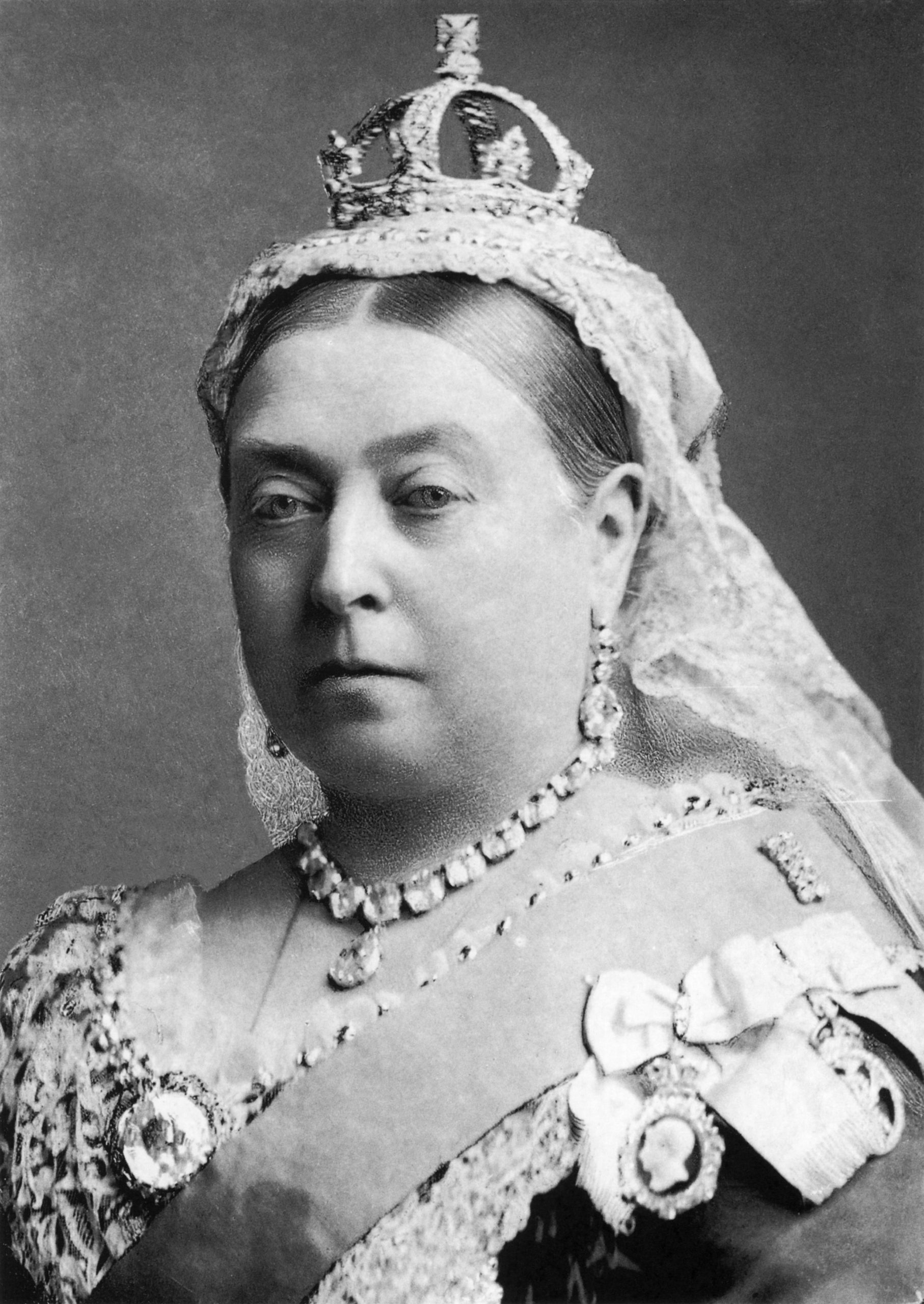 Black and white headshot of Queen Victoria later in her crown and sash
