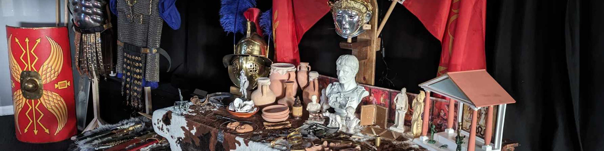 A display of multiple roman artefacts during a workshop in a primary school 