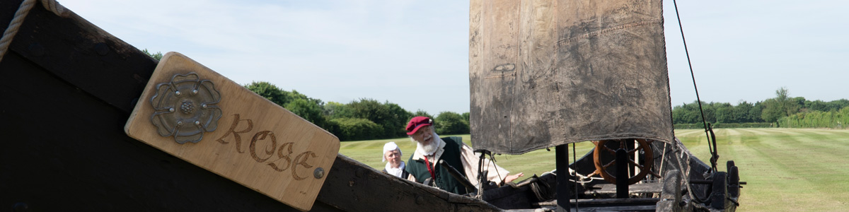 A Visitor portraying Francis Drake with his ship at a Tudor workshop