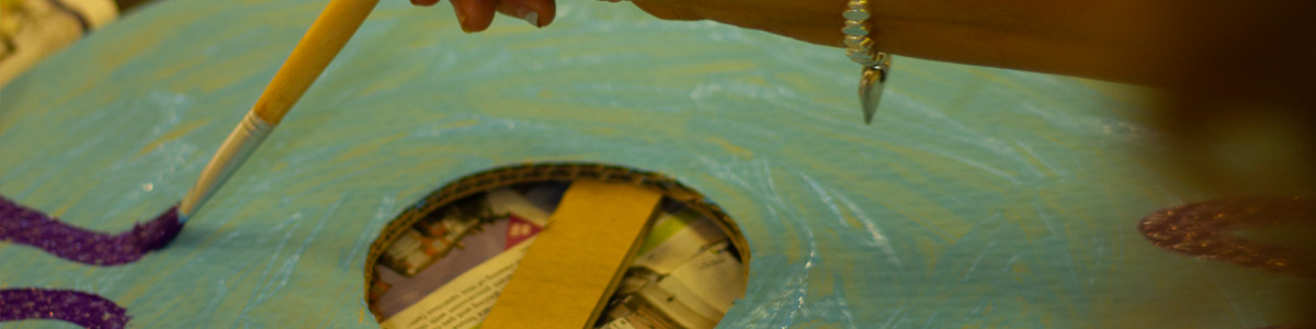 A shield being painted as a activity during a viking workshop