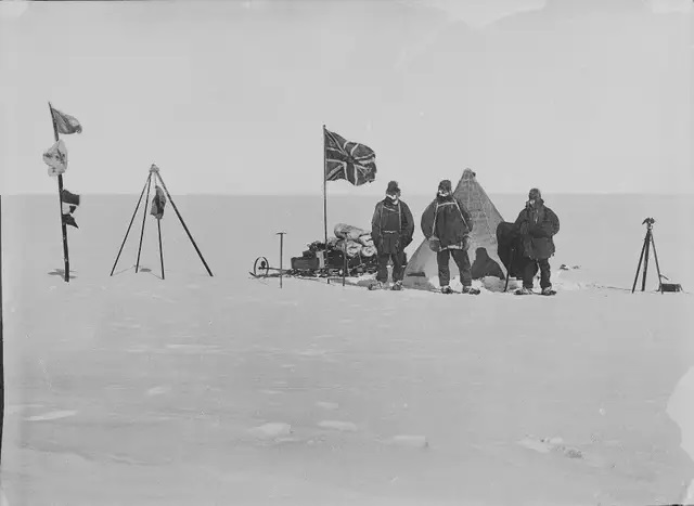 A photograph of Scott's team taken at the South Pole, showing the Norwegian flag alongside the British one